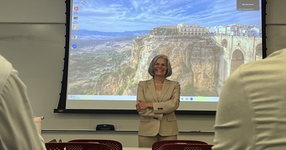 Dr. Gerberding being introduced to Population Health series attendees